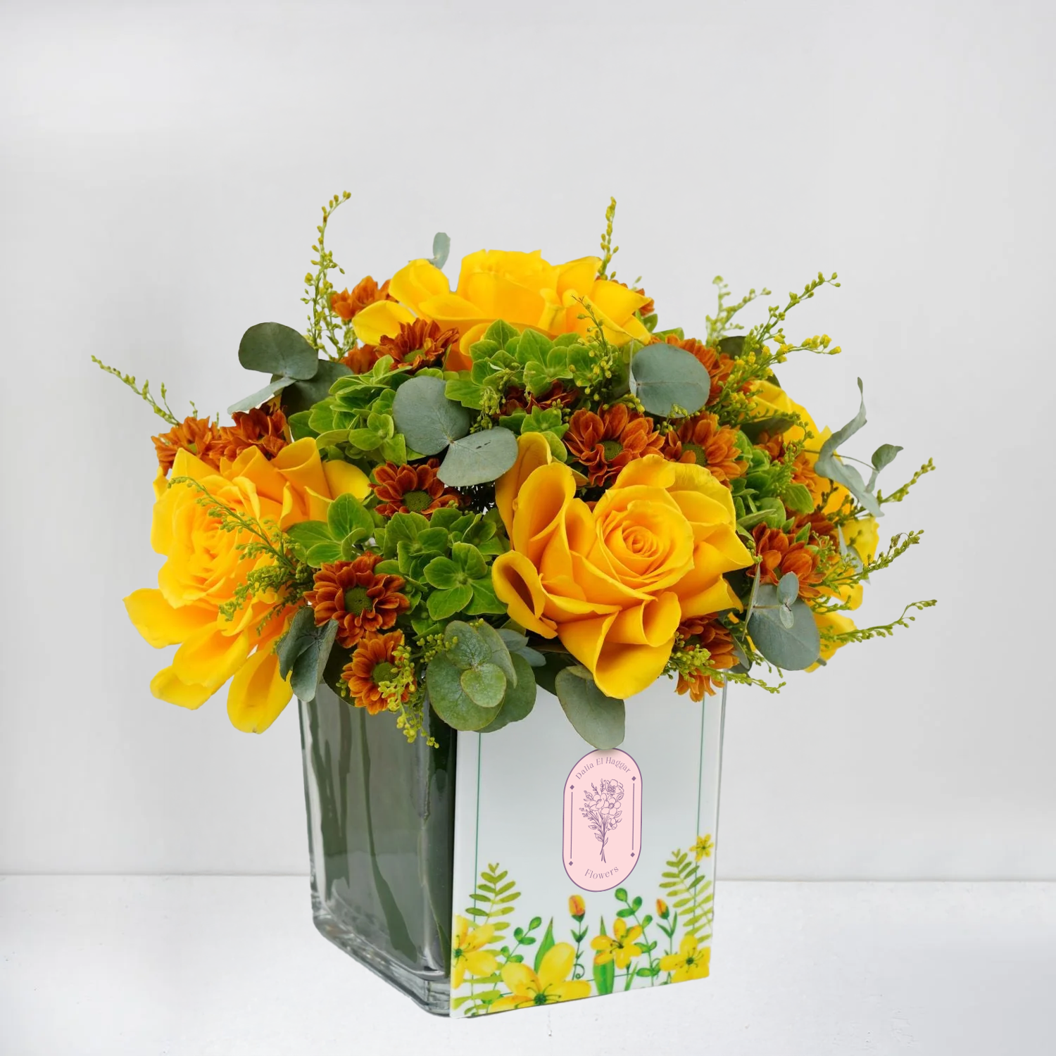 Yellow Roses, Orange Blooms & Greens in Vase